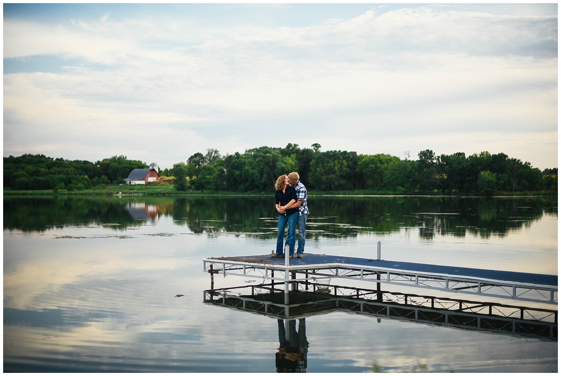 country couple kissing on dock